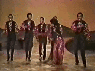 A Group Of Men And Women Are Dancing On A Stage In A Black And White Photo . GIF