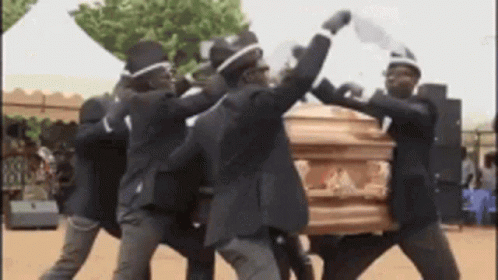 A Group Of Men Are Carrying A Coffin And Dancing . GIF