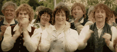 A Group Of Men Are Clapping Their Hands In A Line . GIF