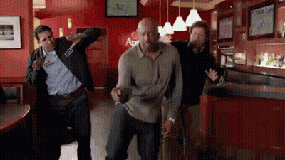A Group Of Men Are Dancing In A Bar With A Sign That Says Apr On It GIF