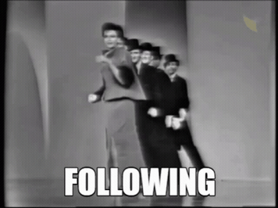 A Group Of Men Are Dancing In A Black And White Photo With The Word Following Above Them GIF