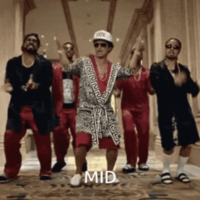A Group Of Men Are Dancing In A Hallway With The Word Mid On The Floor GIF