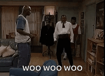 A Group Of Men Are Dancing In A Living Room With The Words `` Woo Woo Woo '' Written On The Screen . GIF