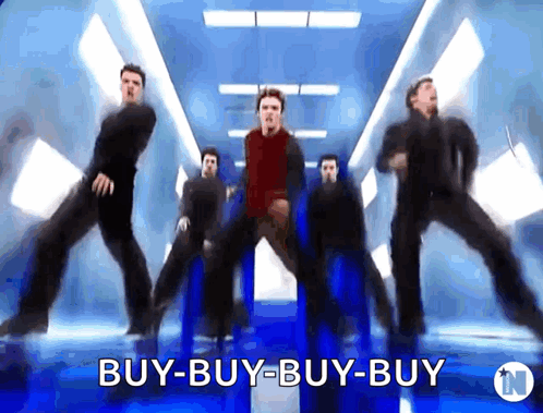 A Group Of Men Are Dancing In A Room With The Words Buy-Buy-Buy In The Corner GIF