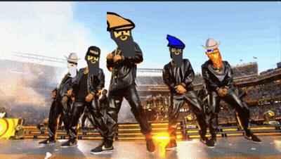 A Group Of Men Are Dancing In A Stadium With Their Faces Drawn On Their Jackets GIF