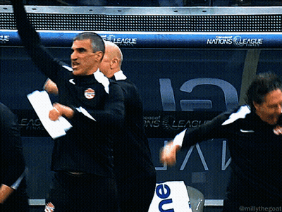 A Group Of Men Are Dancing In Front Of A Banner For The Nations League GIF