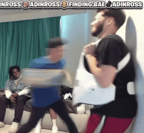 A Group Of Men Are Dancing In Front Of A Sign That Says Inross GIF