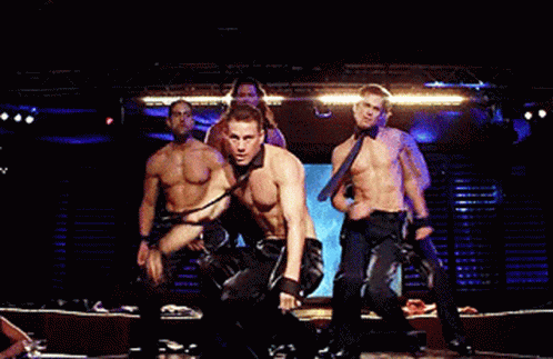 A Group Of Men Are Dancing On A Stage Without Shirts GIF