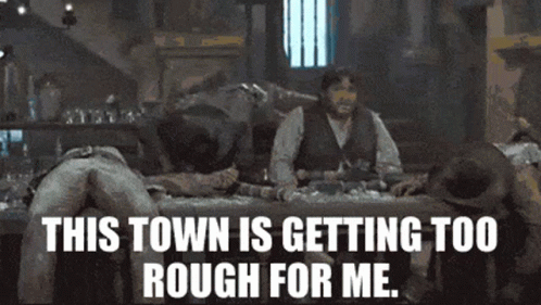 A Group Of Men Are Laying On A Bed With The Words " This Town Is Getting Too Rough For Me " GIF