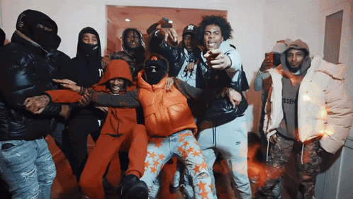 A Group Of Men Are Posing For A Picture And One Of Them Has A Ny On His Hat GIF