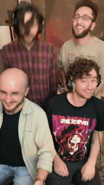 A Group Of Men Are Posing For A Picture And One Of Them Is Wearing A Shirt That Says " Akira " On It GIF