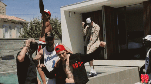 A Group Of Men Are Posing For A Picture And One Of Them Is Wearing A Washington Jersey GIF