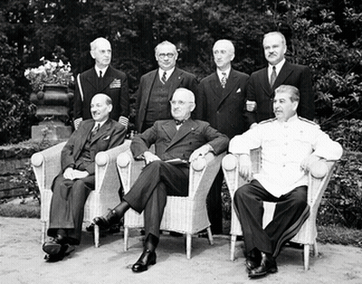 A Group Of Men Are Posing For A Picture While Sitting In Chairs GIF