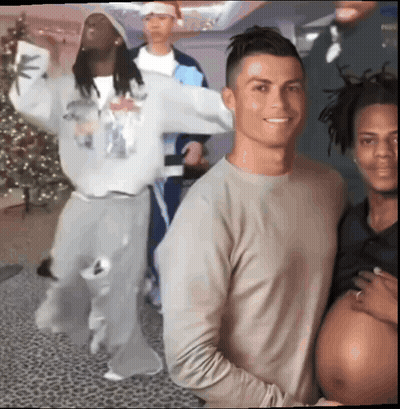 A Group Of Men Are Posing For A Picture With A Pregnant Woman In The Middle GIF