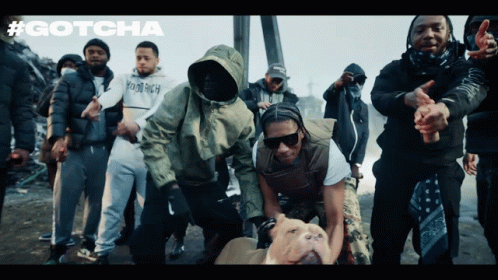 A Group Of Men Are Posing For A Picture With The Word Gotcha On The Bottom GIF
