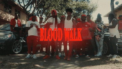 A Group Of Men Are Posing For A Picture With The Words Blood Walk Written In Red GIF