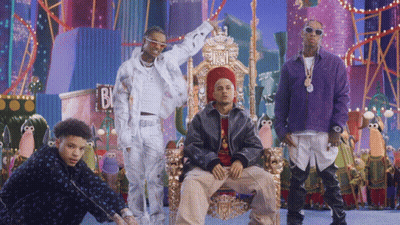 A Group Of Men Are Posing In Front Of A Sign That Says B & J GIF