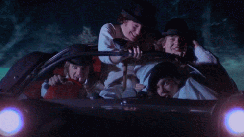 A Group Of Men Are Riding In A Car With A License Plate That Says Stay Alive GIF