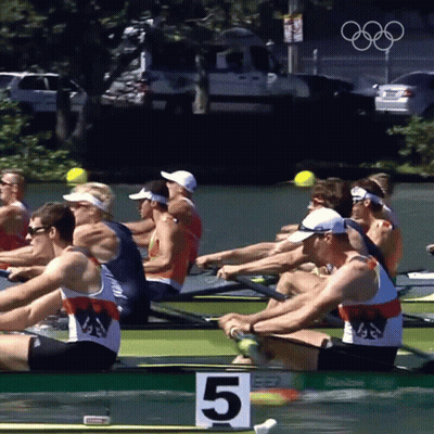 A Group Of Men Are Rowing A Boat With The Number 5 On The Front GIF