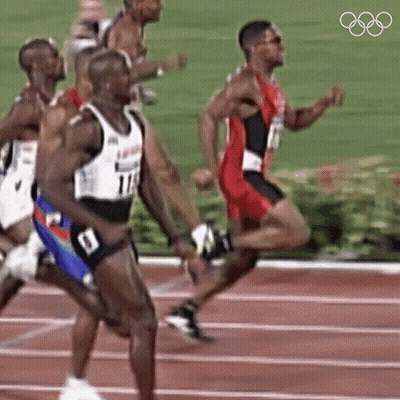 A Group Of Men Are Running On A Track And One Of Them Is Wearing Number 114 GIF