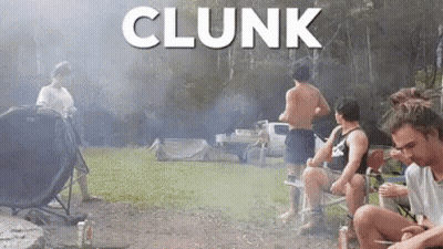 A Group Of Men Are Sitting Around A Campfire With The Word Clunk Written Above Them GIF