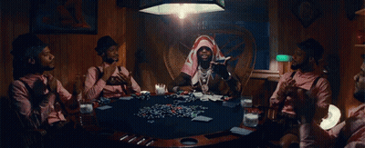 A Group Of Men Are Sitting Around A Poker Table Playing Cards GIF