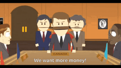 A Group Of Men Are Sitting Around A Table With A Sign That Says Canada GIF