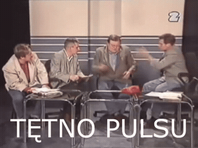 A Group Of Men Are Sitting Around A Table With The Words Tetno Pulsu Written On The Screen . GIF