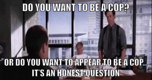 A Group Of Men Are Sitting At A Table And One Of Them Is Asking If They Want To Be A Cop GIF