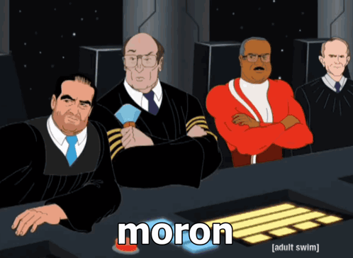 A Group Of Men Are Sitting At A Table And The Word Moron Is On The Bottom GIF