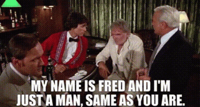 A Group Of Men Are Sitting At A Table In A Bar And Talking . GIF