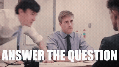 A Group Of Men Are Sitting At A Table With The Words Answer The Question Written On The Screen . GIF