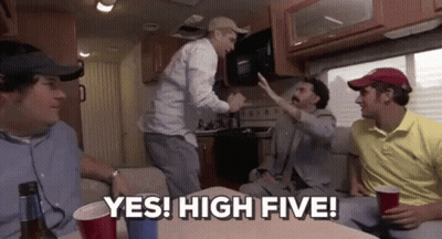 A Group Of Men Are Sitting In A Camper Van And One Of Them Is Giving A High Five . GIF