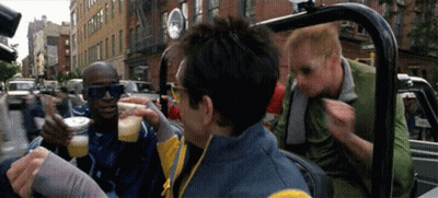 A Group Of Men Are Sitting In A Car Drinking And Eating GIF