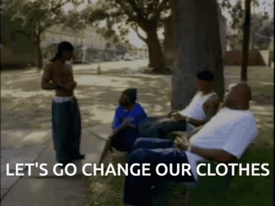 A Group Of Men Are Sitting In A Park With The Words Let 'S Go Change Our Clothes GIF