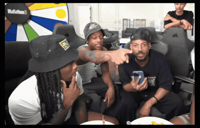 A Group Of Men Are Sitting In Front Of A Mafiathon 3 Display GIF