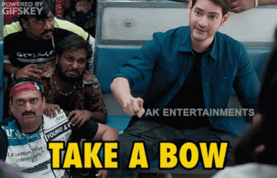 A Group Of Men Are Sitting On A Bus And One Of Them Is Pointing At The Camera And Says " Take A Bow " GIF