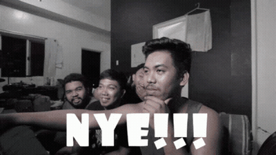 A Group Of Men Are Sitting On A Couch And One Of Them Is Pointing At The Word Nye GIF