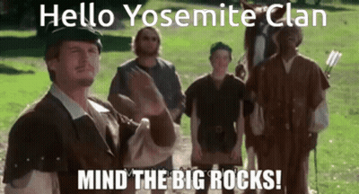 A Group Of Men Are Standing In A Grassy Field And One Of Them Is Saying Hello Yosemite Clan Mind The Big Rocks GIF