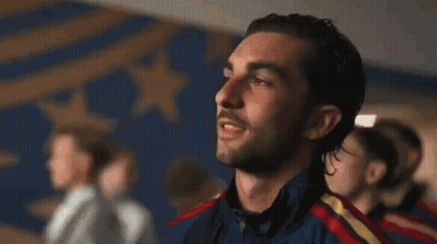 A Group Of Men Are Standing In A Line With Their Eyes Closed And Their Mouths Open . GIF
