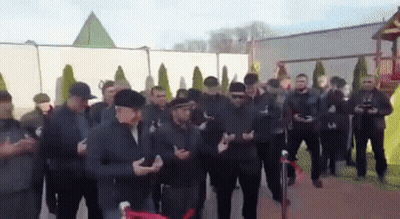 Men Standing In Front Of Pyramid GIF
