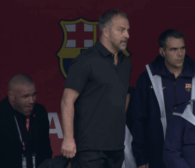 A Group Of Men Are Standing In Front Of A Sign That Says Fcb GIF