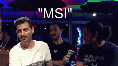 A Group Of Men Are Standing In Front Of A Sign That Says " Msi " On It GIF