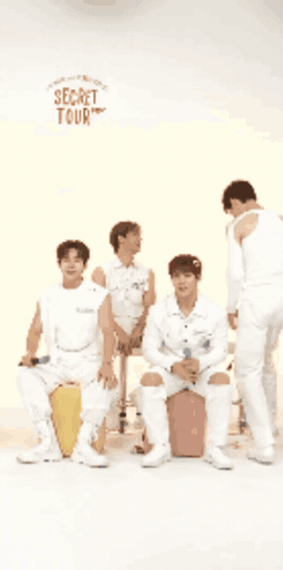 A Group Of Men Are Standing In Front Of A Sign That Says Secret Tour You Got A Clip GIF