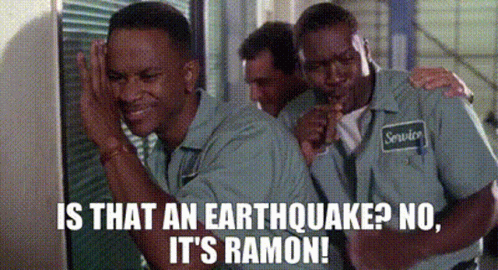 A Group Of Men Are Standing Next To Each Other And One Of Them Is Holding A Microphone . GIF