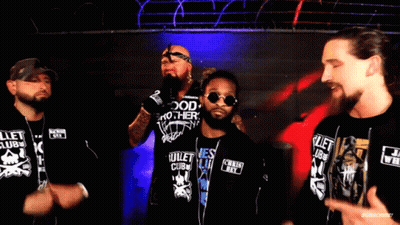 A Group Of Men Are Standing Next To Each Other And One Of Them Is Wearing A Shirt That Says I Know . GIF