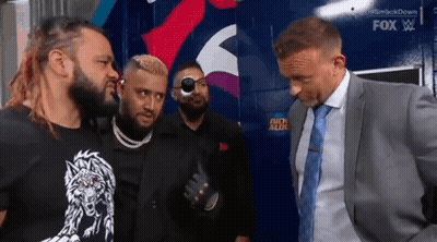 A Group Of Men Are Standing Next To Each Other And Talking . GIF