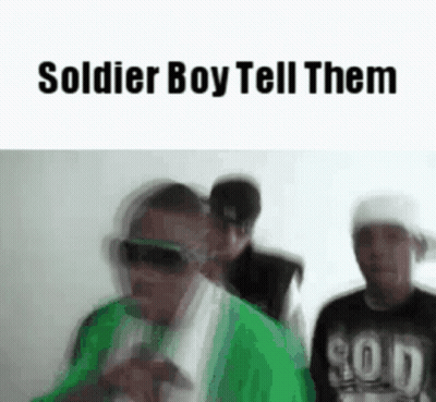 A Group Of Men Are Standing Next To Each Other And The Words `` Soldier Boy Tell Them '' Are On The Screen . GIF
