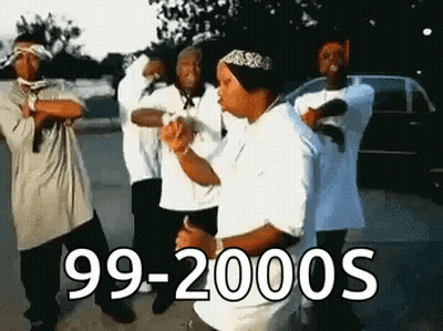 A Group Of Men Are Standing Next To Each Other In A Parking Lot . GIF