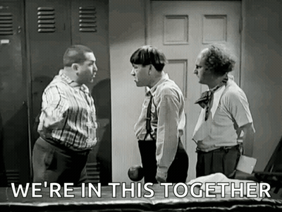 A Group Of Men Are Standing Next To Each Other In A Room And Talking . GIF